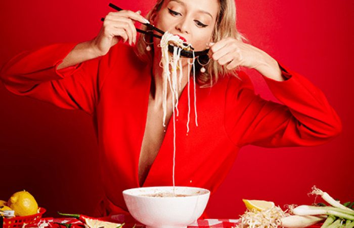 Enjoying eating hot Noodles